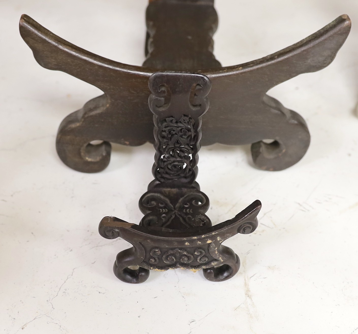 Two Chinese hardwood plate stands and a fret cut rosewood letter rack, 26cm wide
